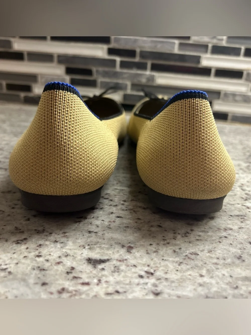 Rothy's Tan/cream Ballet Flats with Black Bow Trim and Blue Piping size 8
